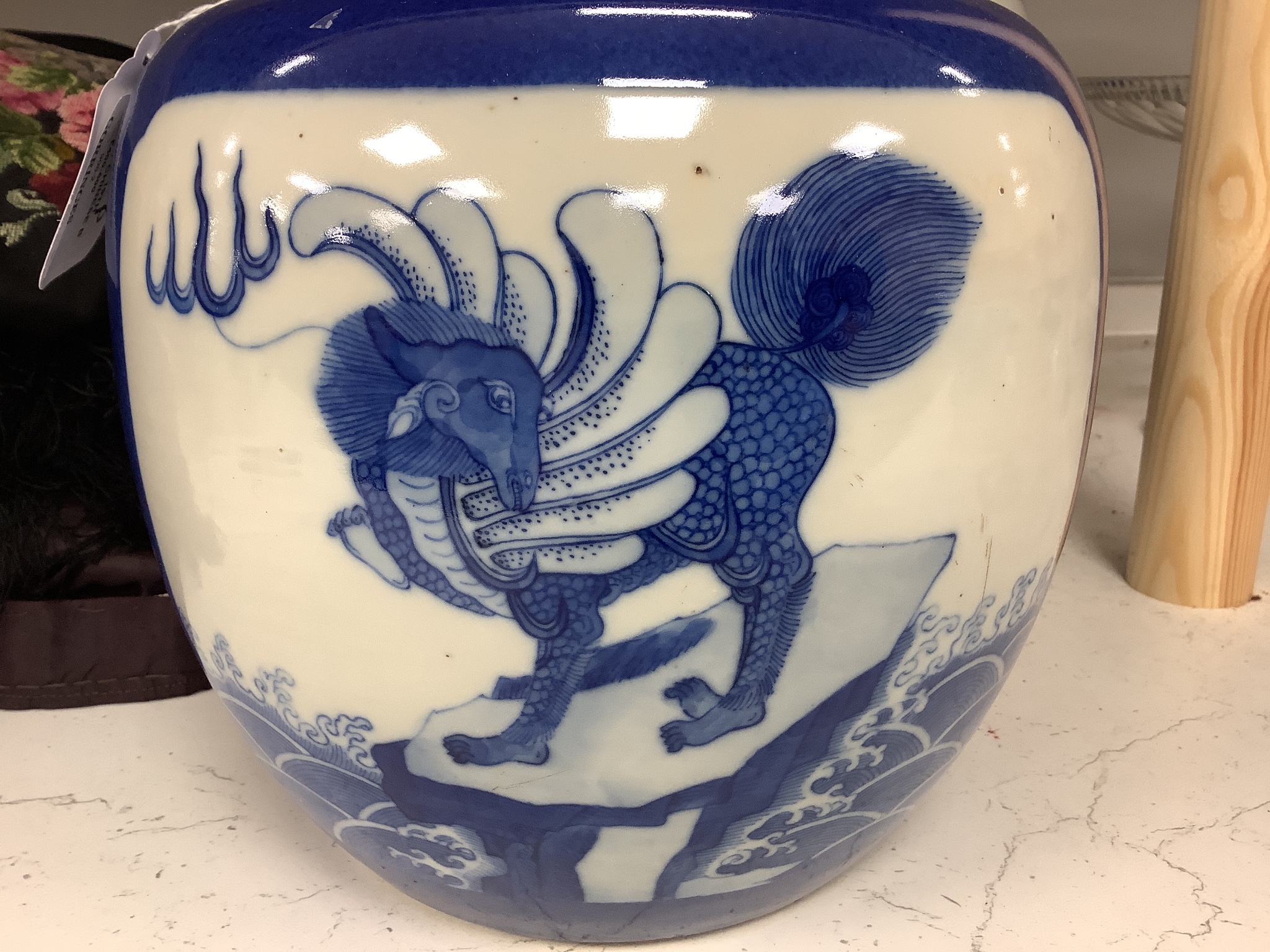 A pair of 19th century Chinese blue and white 'mythical beast' jars